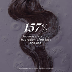 LolaVie Exfoliate & Detox Scrub texture close-up reveals exfoliation with charcoal and AHAs.