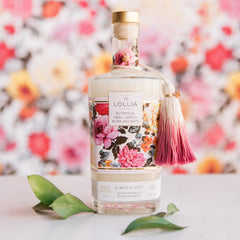 Lollia bubble bath close-up shows rich bubbles and rose-hibiscus scent.