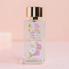 Close-up of blossom detailing on LOLLIA Relax bottle for gifting appeal