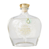 LOLLIA Snowdrop bubble bath bottle showcases frosted glass with gold accents for an elegant spa look.
