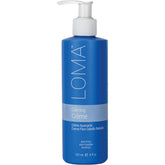 LOMA Calming Crème bottle showing weightless hydration and frizz control for everyday styling