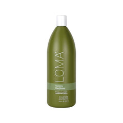 Loma Nourishing Conditioner bottle pouring for silky, hydrated hair