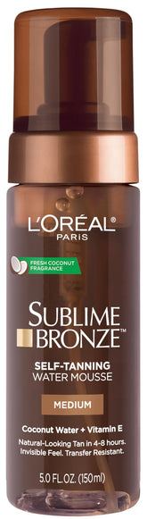 L'Oreal Paris Sublime Bronze water mousse bottle showing a natural tan glow from a lightweight formula.