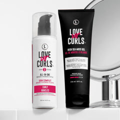 Love Ur Curls hands applying curl cream for smooth styling.