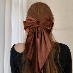 LSVOZ brown velvet hair bow worn by model for fall styling