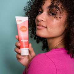 Lume Peony Rose applying underarm to prevent odor with gentle rub.