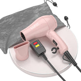 LURA foldable travel hair dryer in light pink—compact design for effortless packing on trips.
