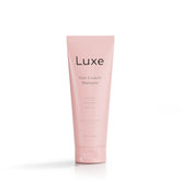Luxe Cosmetics Hair Growth Shampoo bottle closeup highlighting plant-based formula for healthier, fuller hair.