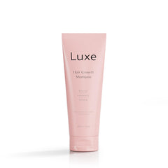 Luxe Cosmetics Hair Growth Shampoo bottle closeup highlighting plant-based formula for healthier, fuller hair.