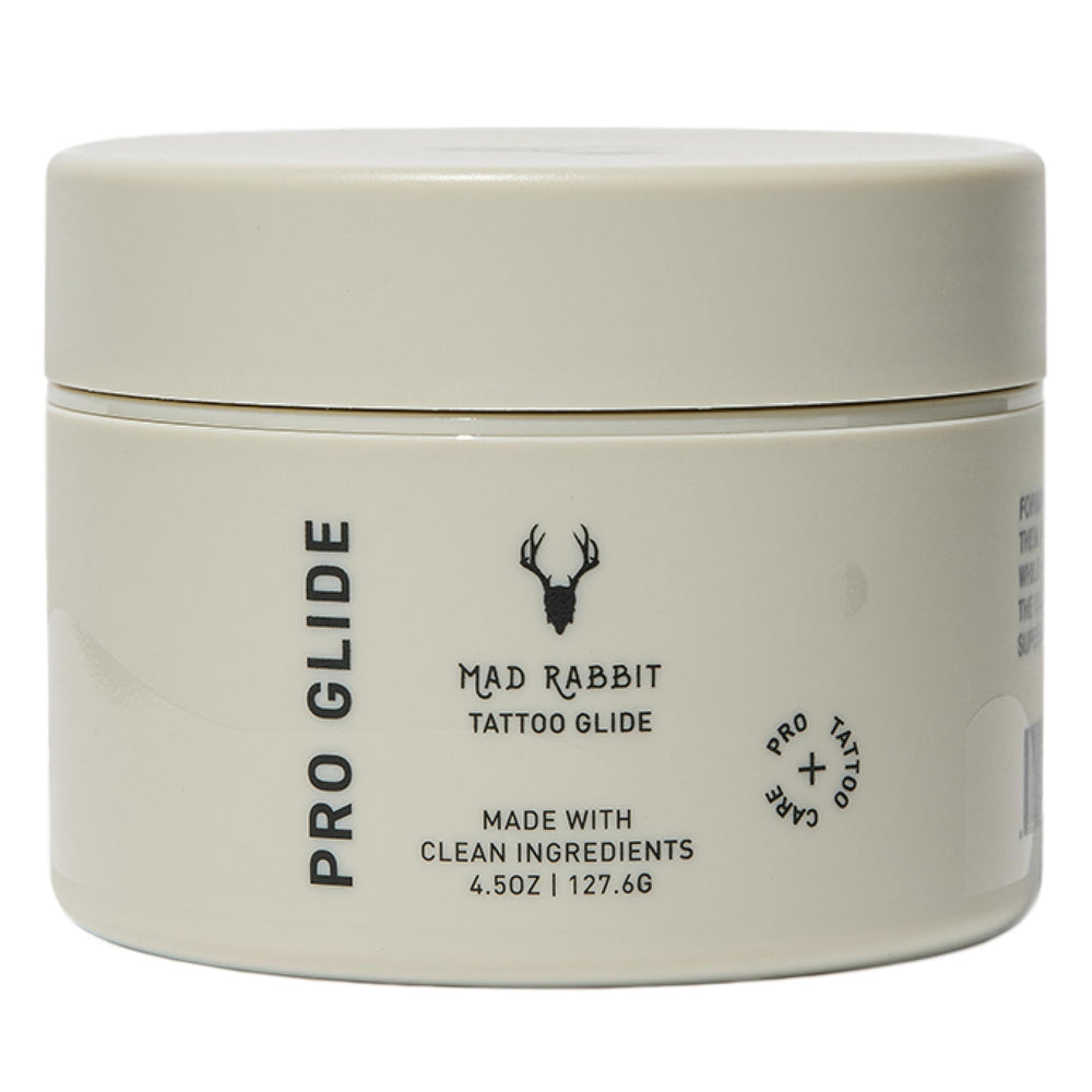 Mad Rabbit Tattoo Artist Glide bottle on a clean studio station for smooth tattooing and skin protection.