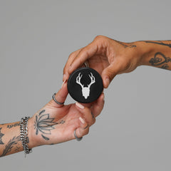 Mad Rabbit Tattoo Balm on skin close-up showing gentle hydration across tattoo