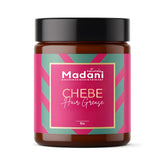 Madani Naturals Chebe Hair Grease jar closeup — creamy texture supports scalp nourishment.