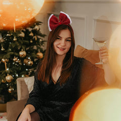 Madison Tyler Christmas bow headband with white fluff detail enhances comfort during celebrations.