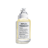 Maison Margiela Replica Afternoon Delight bottle closeup with warm gourmand character.