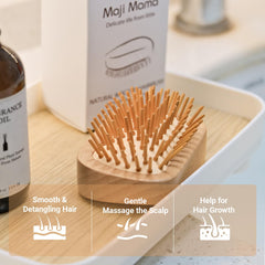 Maji Mama bamboo pins close-up showing gentle detangling action.