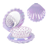 Maji Mama foldable travel hair brush with mirror in purple for quick styling on the go.