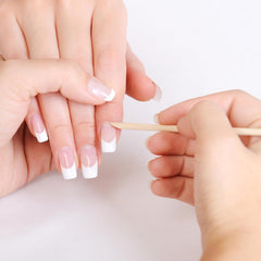 Makartt wooden sticks for precise glue removal around nails.