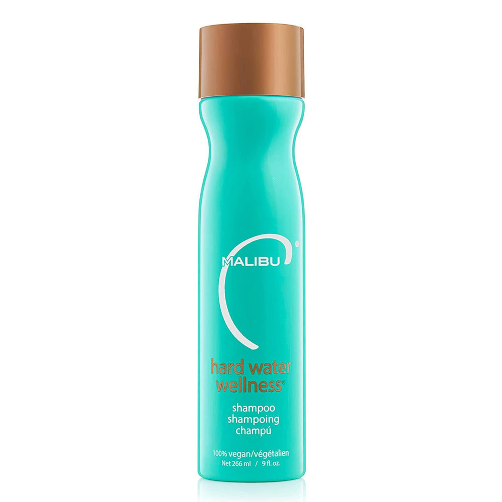 Malibu C Hard Water Wellness Shampoo bottle closeup shows mineral removal and hydration.