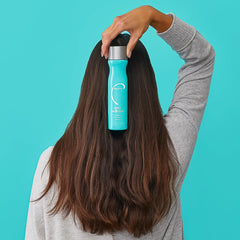 Malibu C Scalp Wellness Shampoo spearmint-leaf closeup signals refreshing scent and clarity.