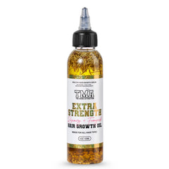 The Mane Attraction extra-strength rosemary fenugreek oil bottle pour for targeted scalp nourishment.