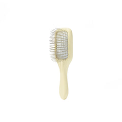 Mane Ready or Knot Mini Detangler Brush metal bristles close-up, promotes oil distribution.