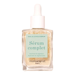 Manucurist Complete Serum on nails promoting hydrated cuticles and strength.