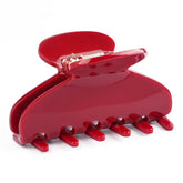 Maorulu 3inch cherry red acetate clip shown in action for everyday styling.