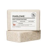 MARLOWE No.102 Oud Wood body scrub close-up showing pumice exfoliation for smoother skin