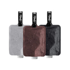 Matador FlatPak three-pack assembled shows compact bottles for minimalist travel kits.