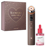 Medicube Booster Pro Holiday Set display shows a gift-ready kit for radiant skin.