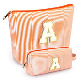 Mibasies initial makeup bags orange A front view for portable cosmetics organization.