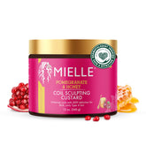 Mielle Organics Pomegranate & Honey Curl Cream bottle ready for hydration.