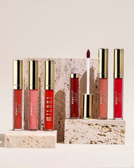 Milani Stay Put lipstick applied on lips highlighting Go Off shade and even coverage.