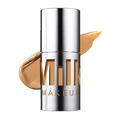 Milk Makeup Future Fluid Concealer tube close-up shows creamy texture for natural coverage