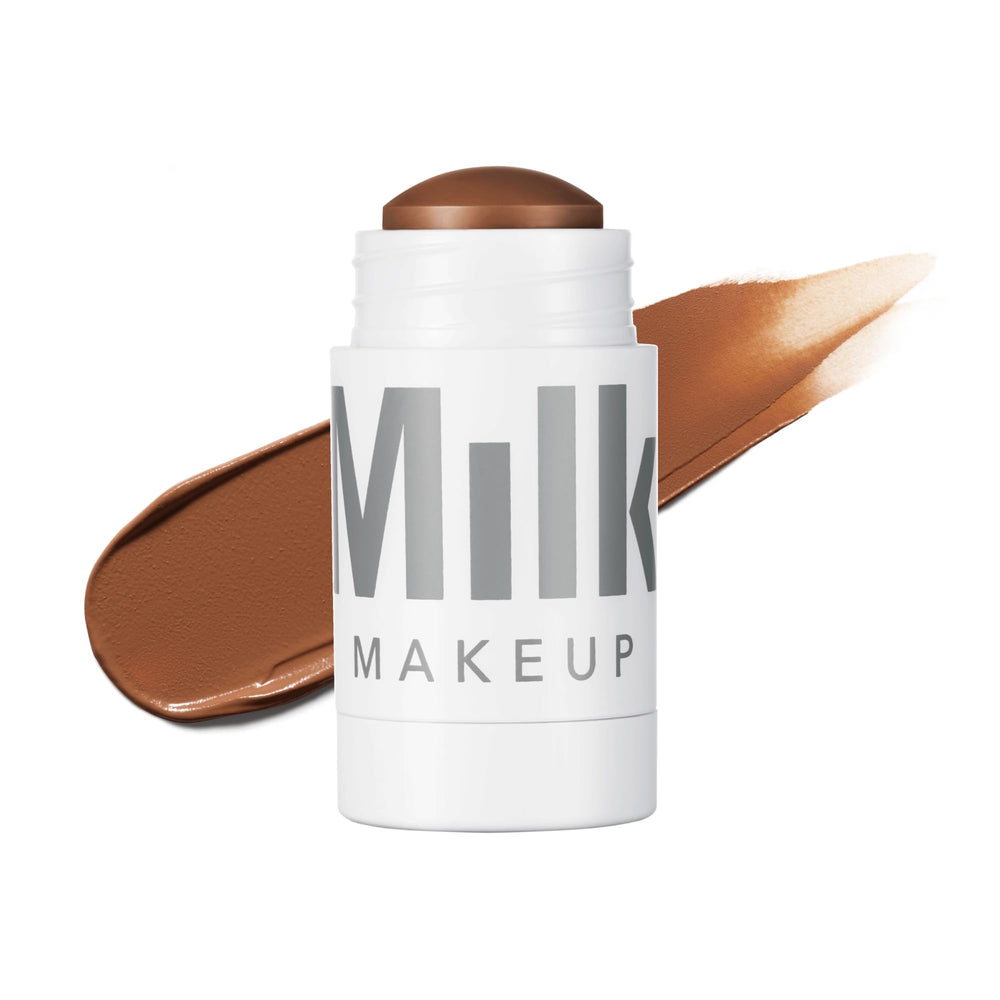 Milk Makeup Matte Bronzer stick on forehead and cheekbones for a natural glow