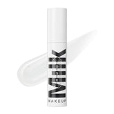 Milk Makeup Odyssey Lip Gloss jar closeup shows glossy shine and smooth texture