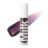 Milk Makeup Odyssey Lip Gloss wand application shows non-sticky shine and hydration.