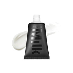 Milk Makeup Pore Eclipse Primer bottle close-up showing pore-blurring effect.