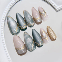 Uñas MINGCHUN ojo de gato, almendra corta, diseño marmolado en 3D para elegancia diaria.