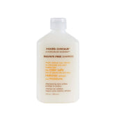Mixed Chicks sulfate-free shampoo bottle closeup, gentle cleanse for color-treated hair.