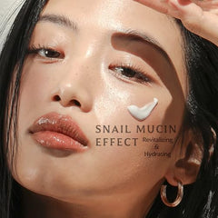 MIZON Black Snail All-In-One Cream spread on hand for smooth application.