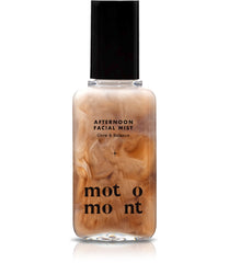 Motomont Milk Tea Dewy Skin Mist bottle showcases hydrating formula for dewy makeup.