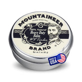 Mountaineer Brand natural heavy-duty beard balm timber bottle demonstrates rugged conditioning for daily wear.