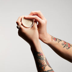 Texture Paste applied to dry hair delivering natural texture without grease.