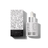 Naked & Thriving Illuminate serum bottle closeup for radiant skin