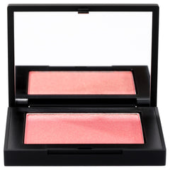 NARS Blush Orgasm swatch on skin shows peach-pink with golden shimmer, radiant cheeks