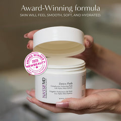 NassifMD Exfoliating Detox Pads jar on counter suggests deep cleansing and pore refinement