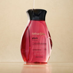 NATIVA SPA Plum Body Oil pour — easy application for quick hydration after shower.