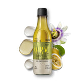 Natura Passion Fruit Triple Phase Oil bottle being shaken for even texture and hydration.