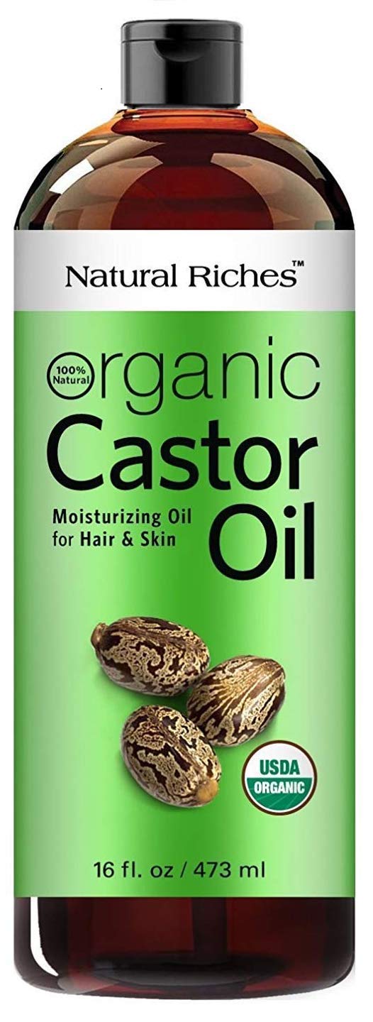 Natural Riches Castor Oil in an amber bottle for daily skin and hair care.